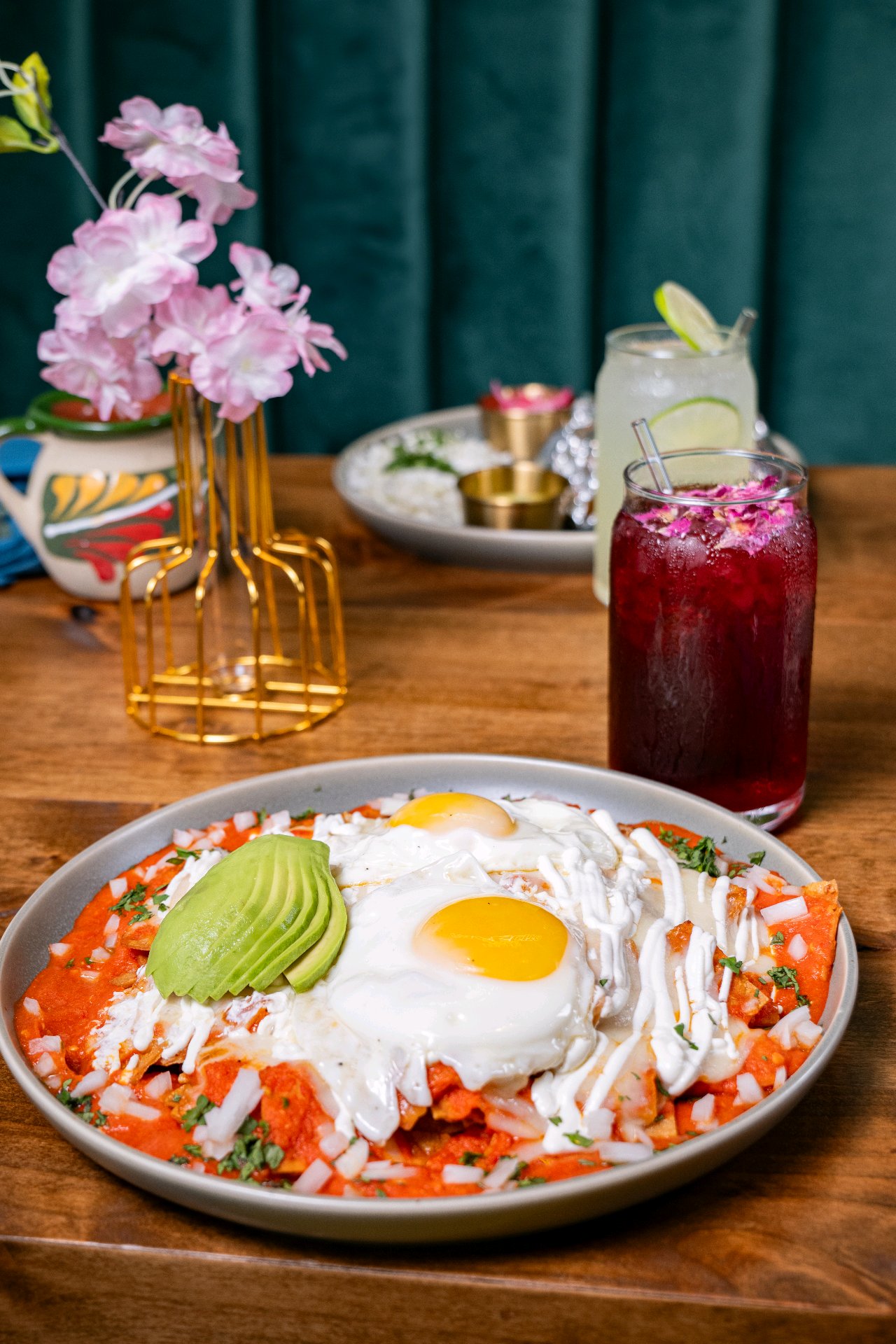 Chilaquiles topped with egg and avocado