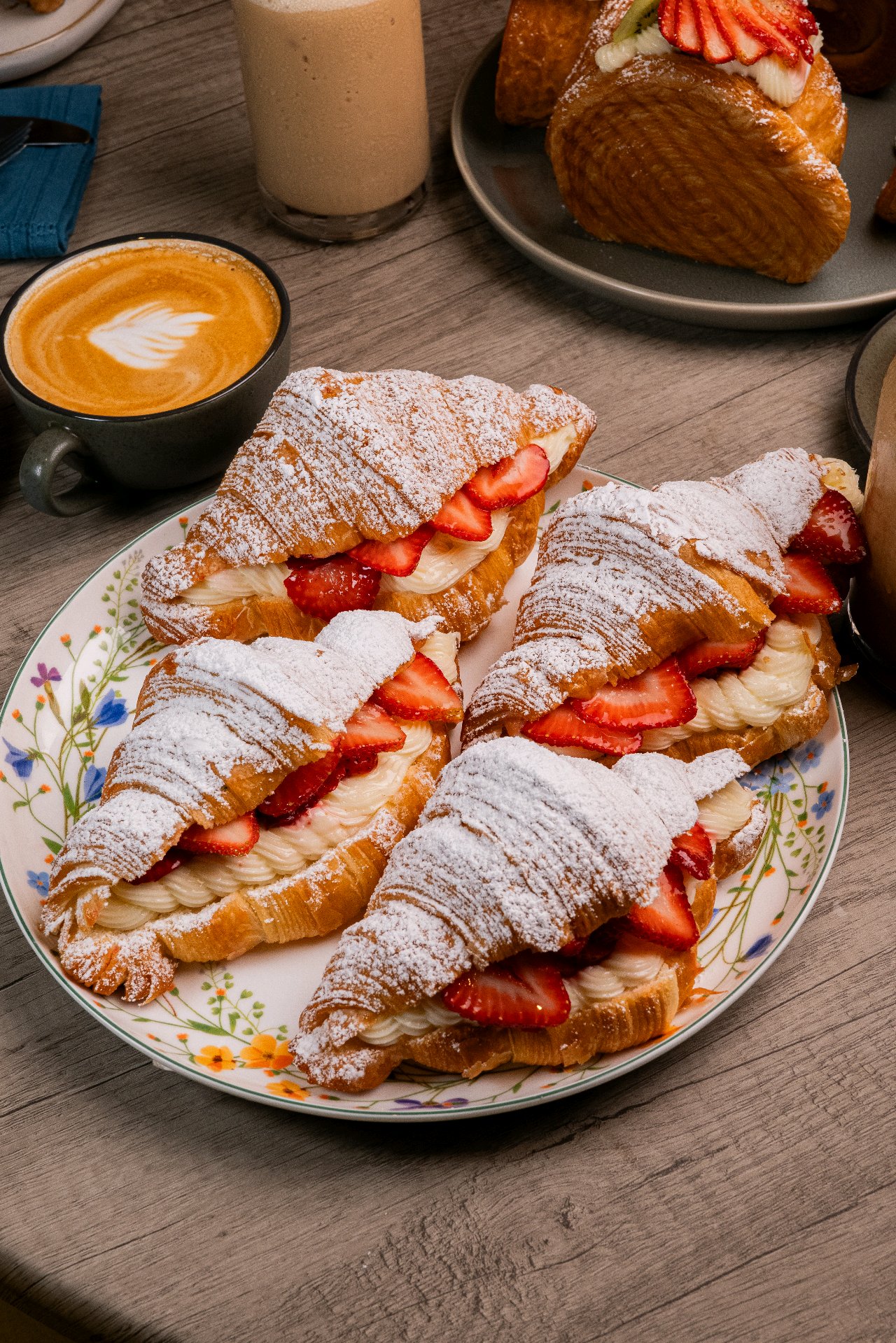 Strawberry cream croissants with a cappuccino